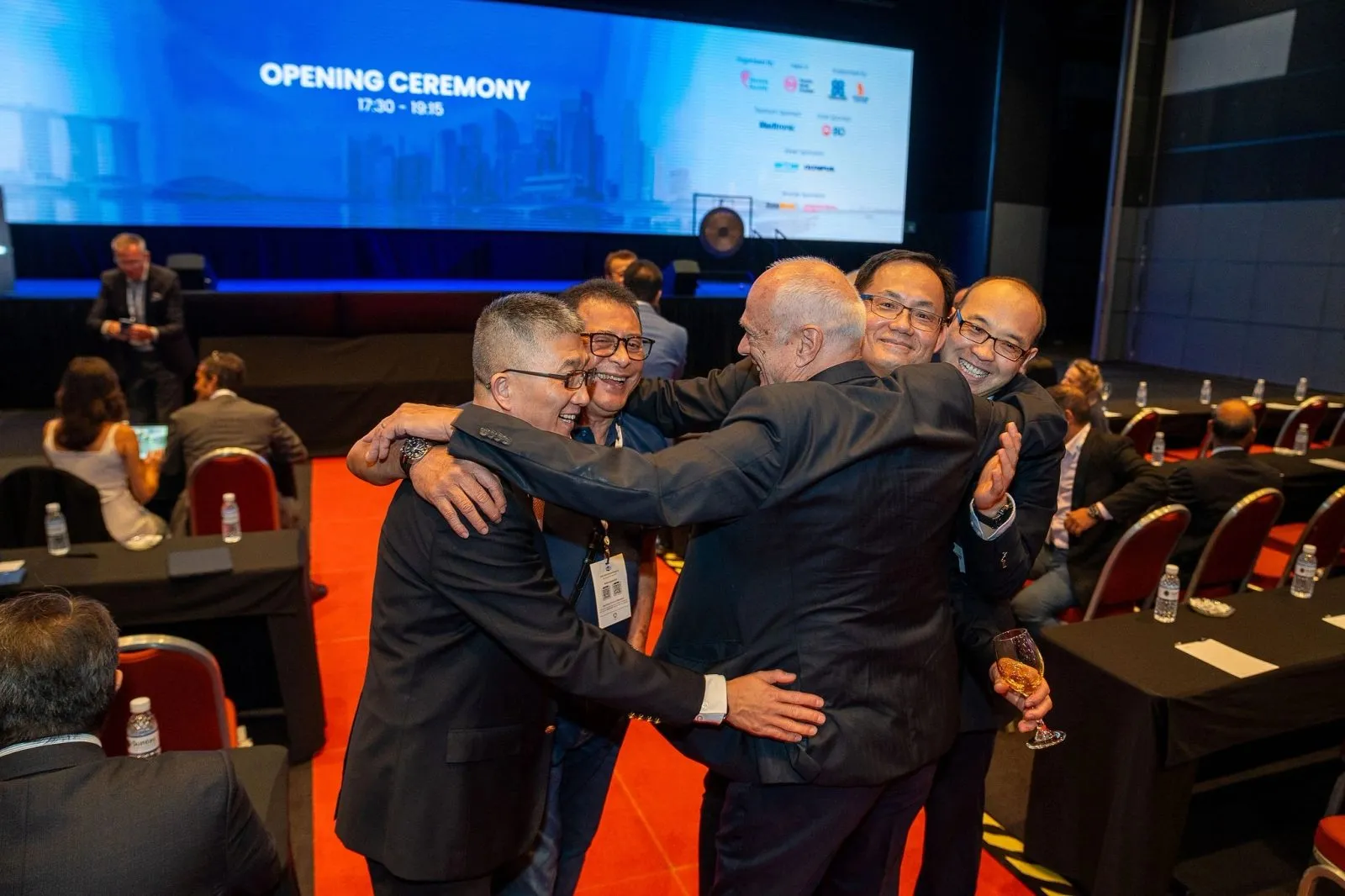 Delegates celebrating at the opening ceremony of an international congress in Singapore