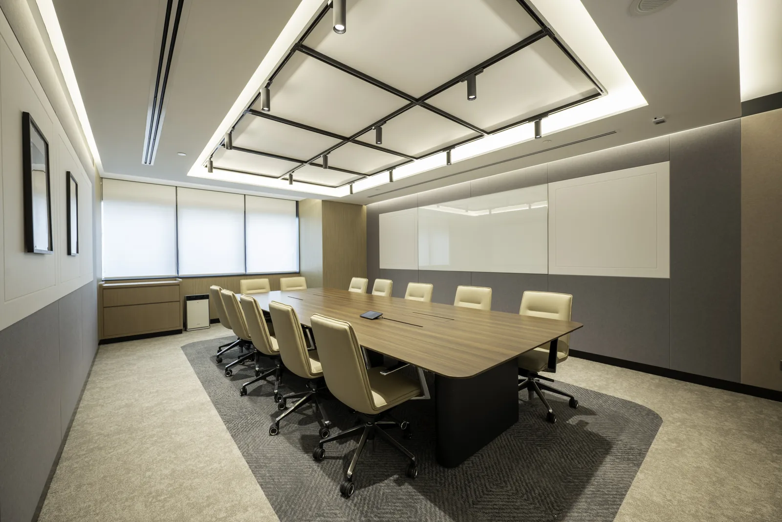 Competent architectural shot of an empty boardroom — clean symmetry, controlled verticals, corporate-adjacent