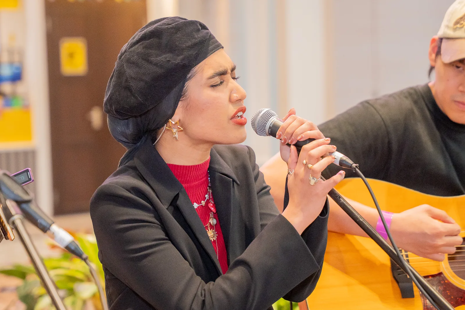 Live vocalist mid-phrase with real emotion — good timing and colour, gala/entertainment relevance