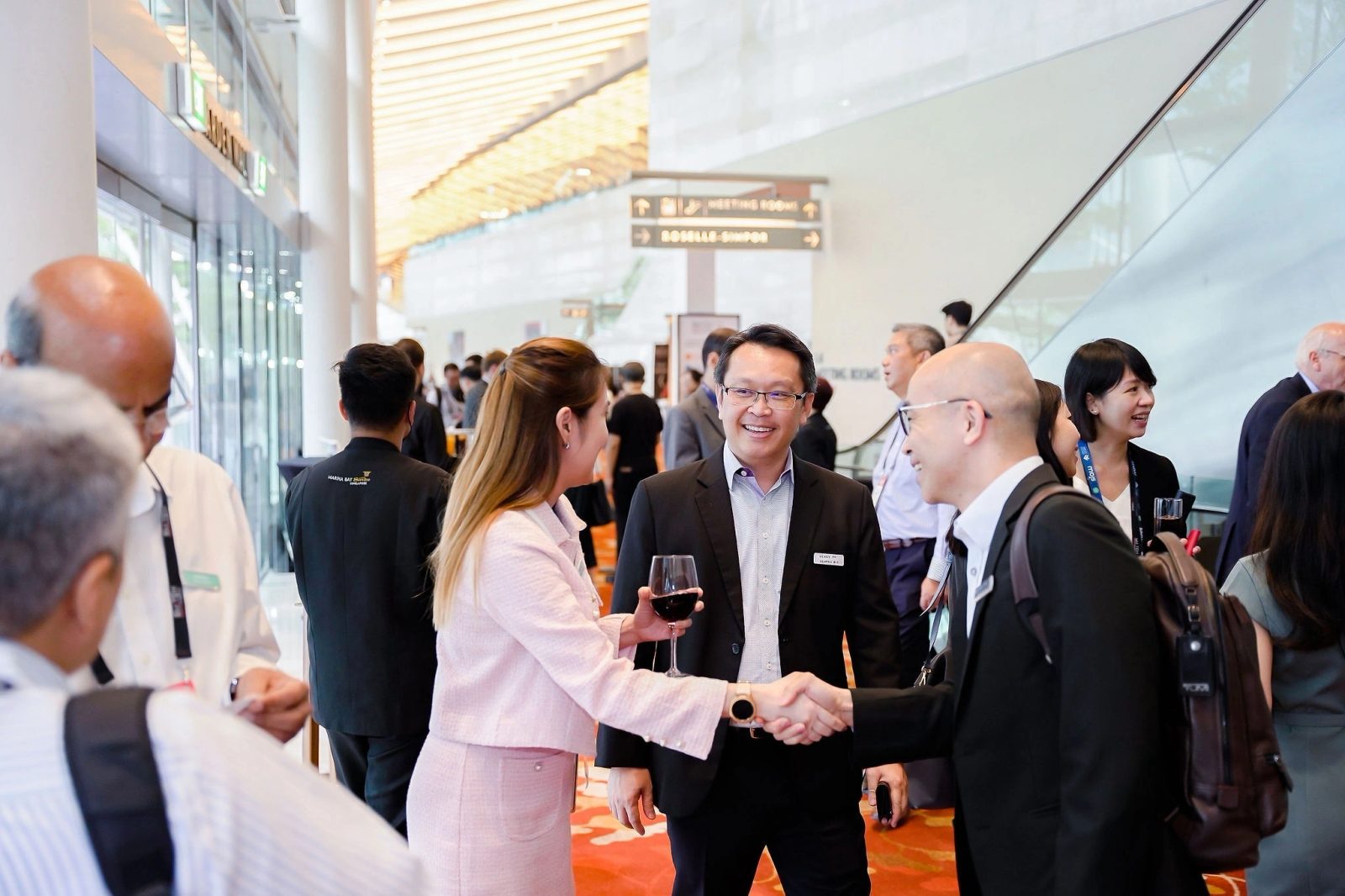 Delegates networking in a bright convention centre lobby