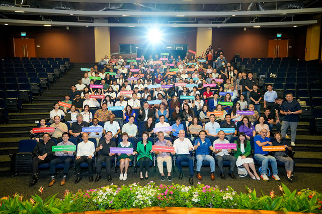 Auditorium group photo from a corporate event gallery