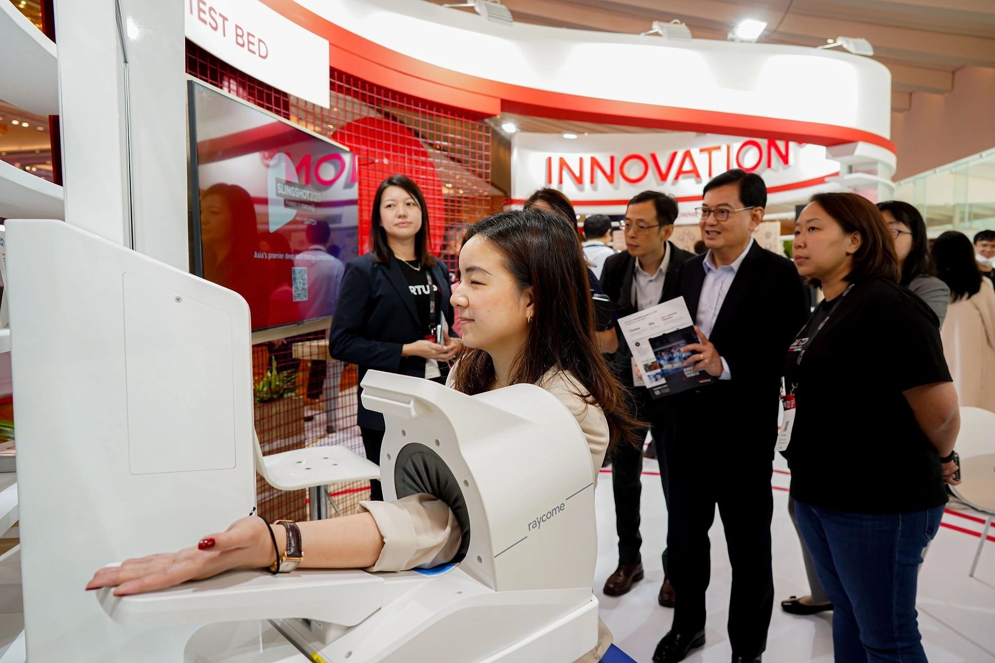 VIP delegation touring an innovation showcase at a trade exhibition