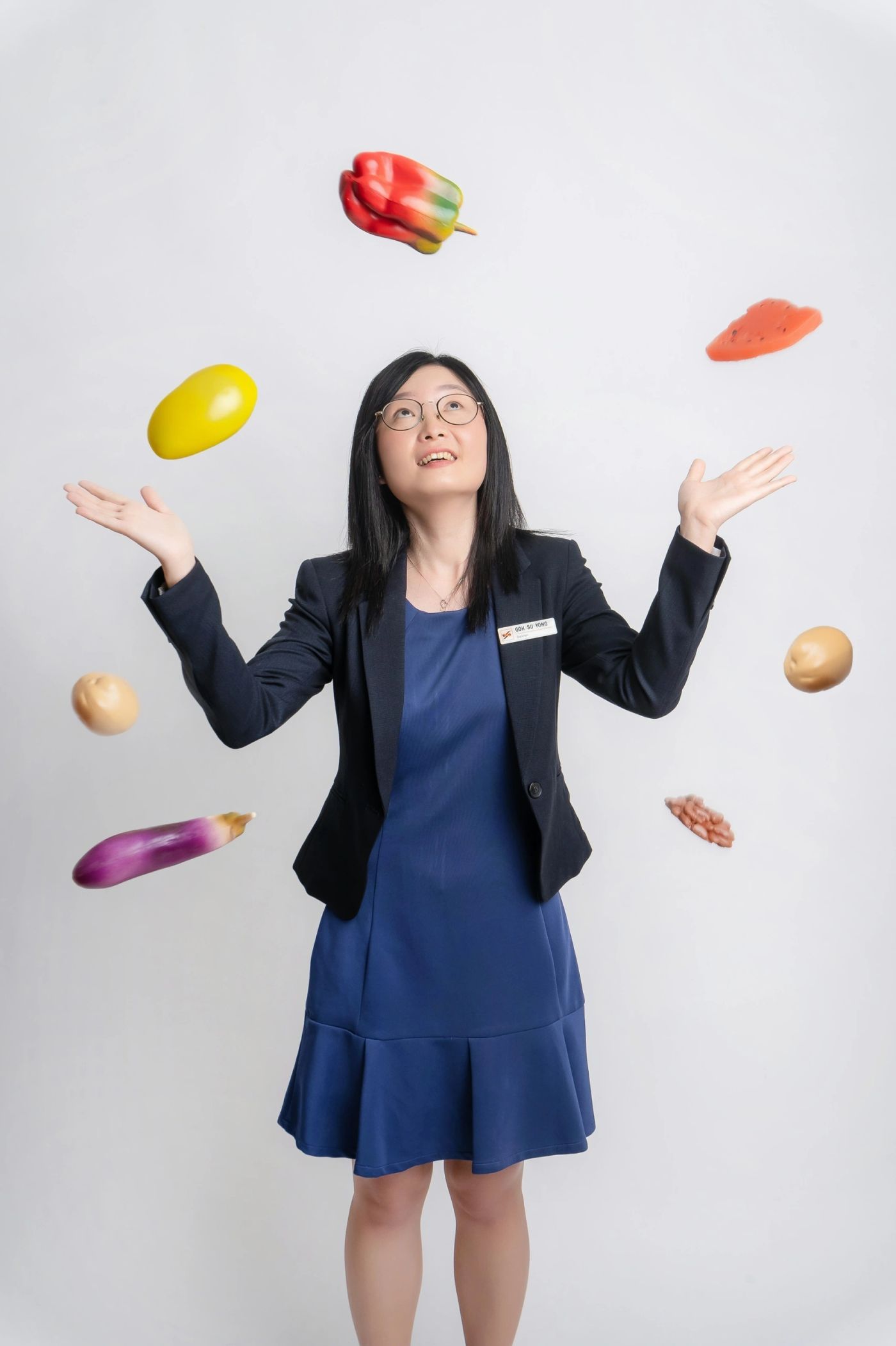 Playful corporate portrait with levitating vegetables