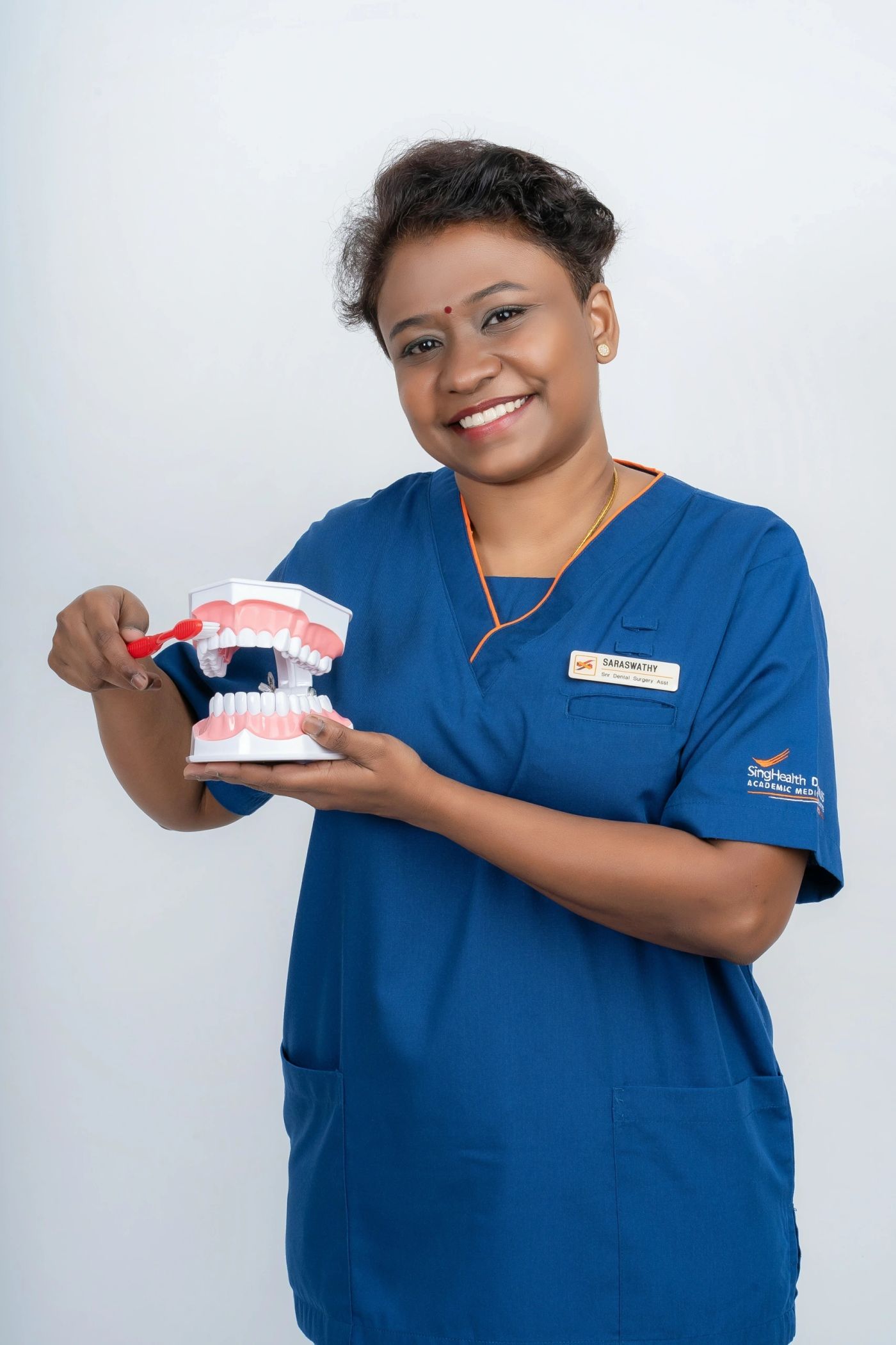 Creative portrait of a dental professional with a prop